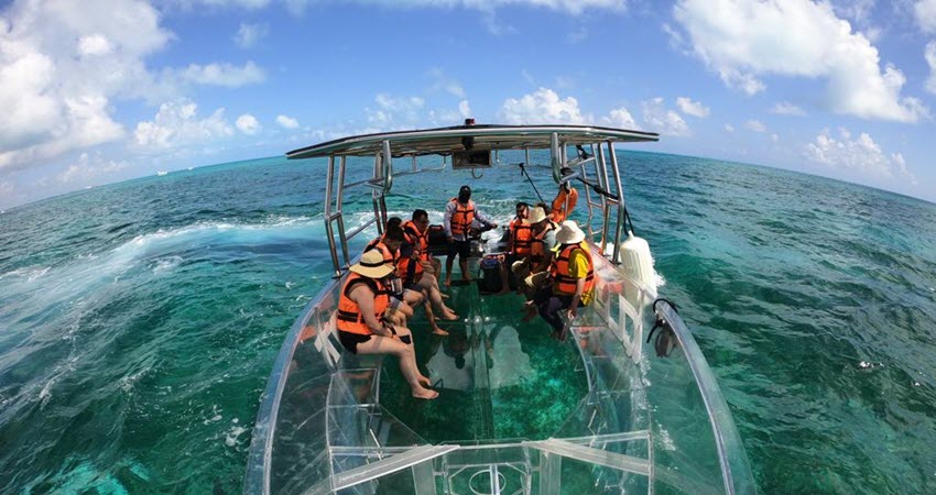 Cruising Isla Mujeres With A Transparent Boat